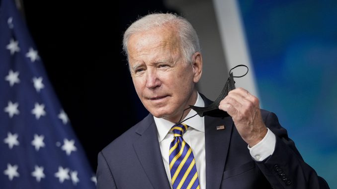 Joe-Biden-holds-mask.jpg